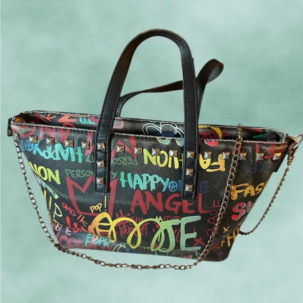Fun, graffiti print with decorative stud details and chain straps